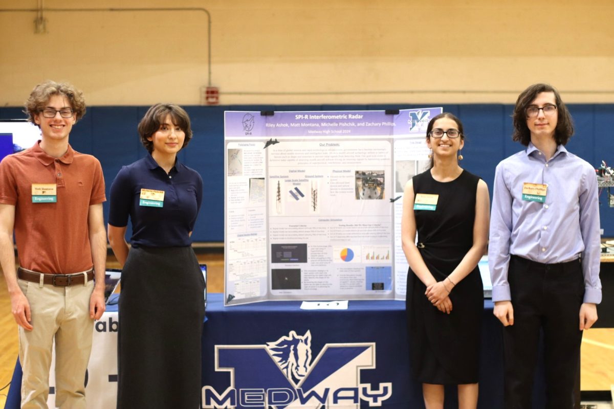 Matt Montana. Michelle Pishchik, Riley Ashok, and Zachary Phillips present at the Innovation Showcase