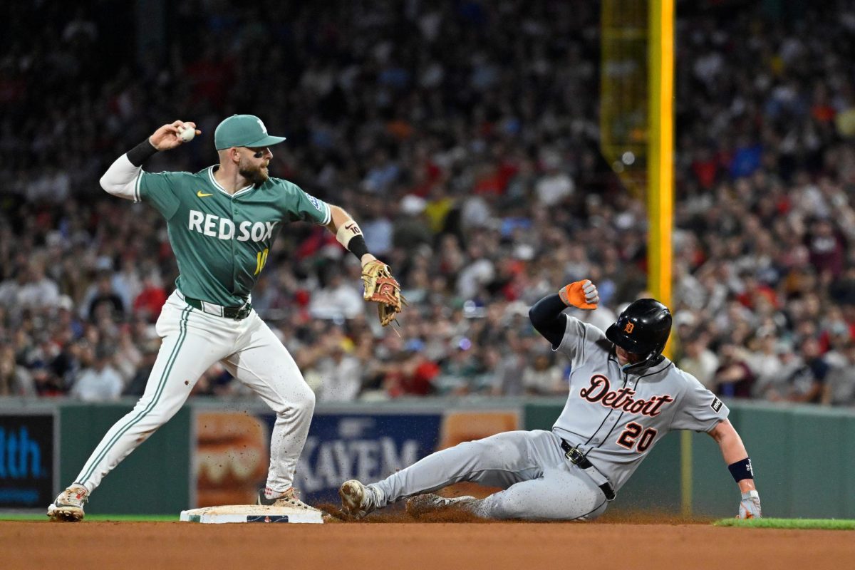 Sep 26, 2025; Boston, Massachusetts, USA; Detroit Tigers first baseman Spencer Torkelson (20) is out at second base as Boston Red Sox shortstop Trevor Story (10) throws the ball to first base for a double play during the seventh inning at Fenway Park. Mandatory Credit: Eric Canha-Imagn Images