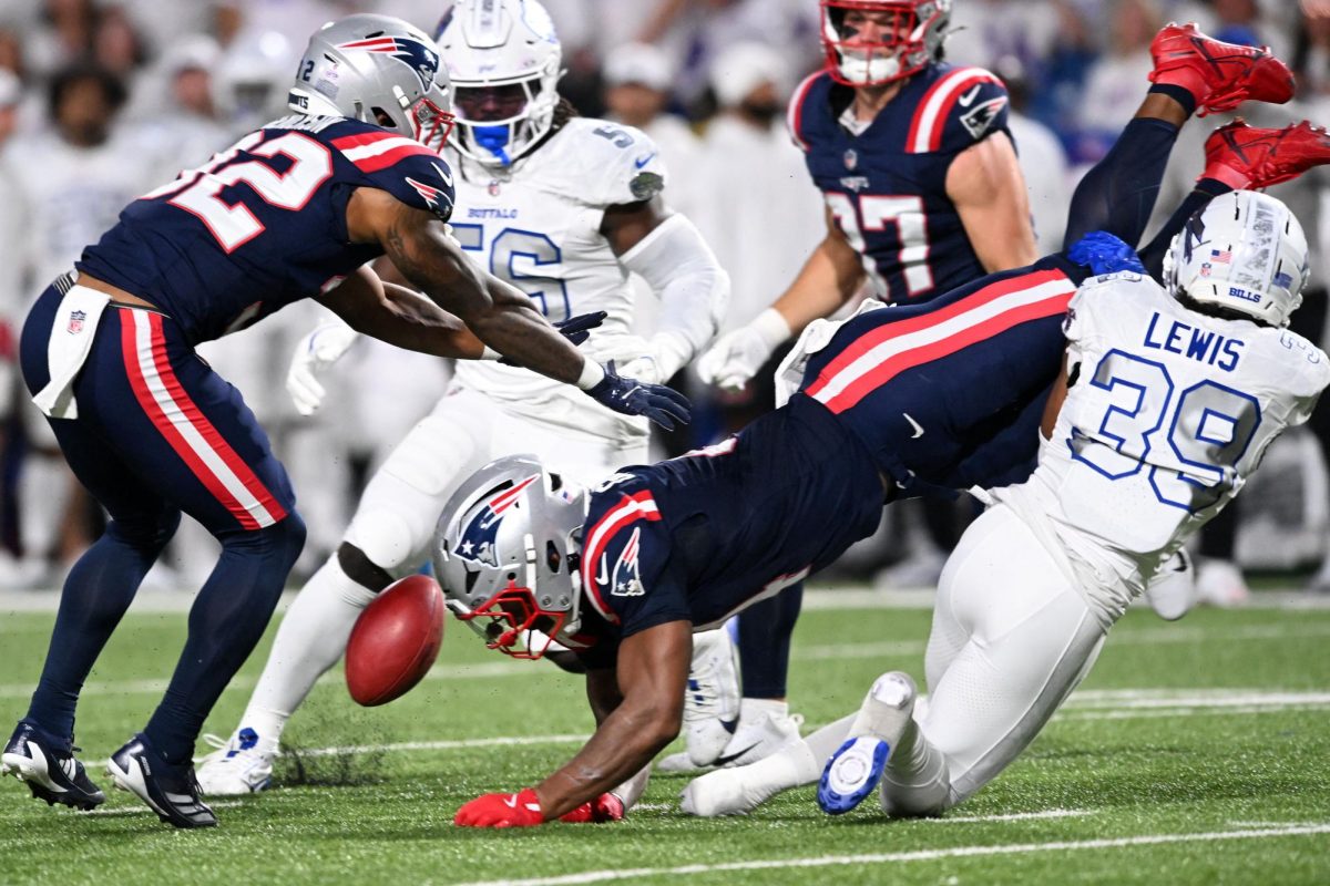 Oct 5, 2025; Orchard Park, New York, USA; Buffalo Bills cornerback Cam Lewis (39) tackles New England Patriots running back Antonio Gibson (4) to fumble during the first half at Highmark Stadium. Mandatory Credit: Mark Konezny-Imagn Images