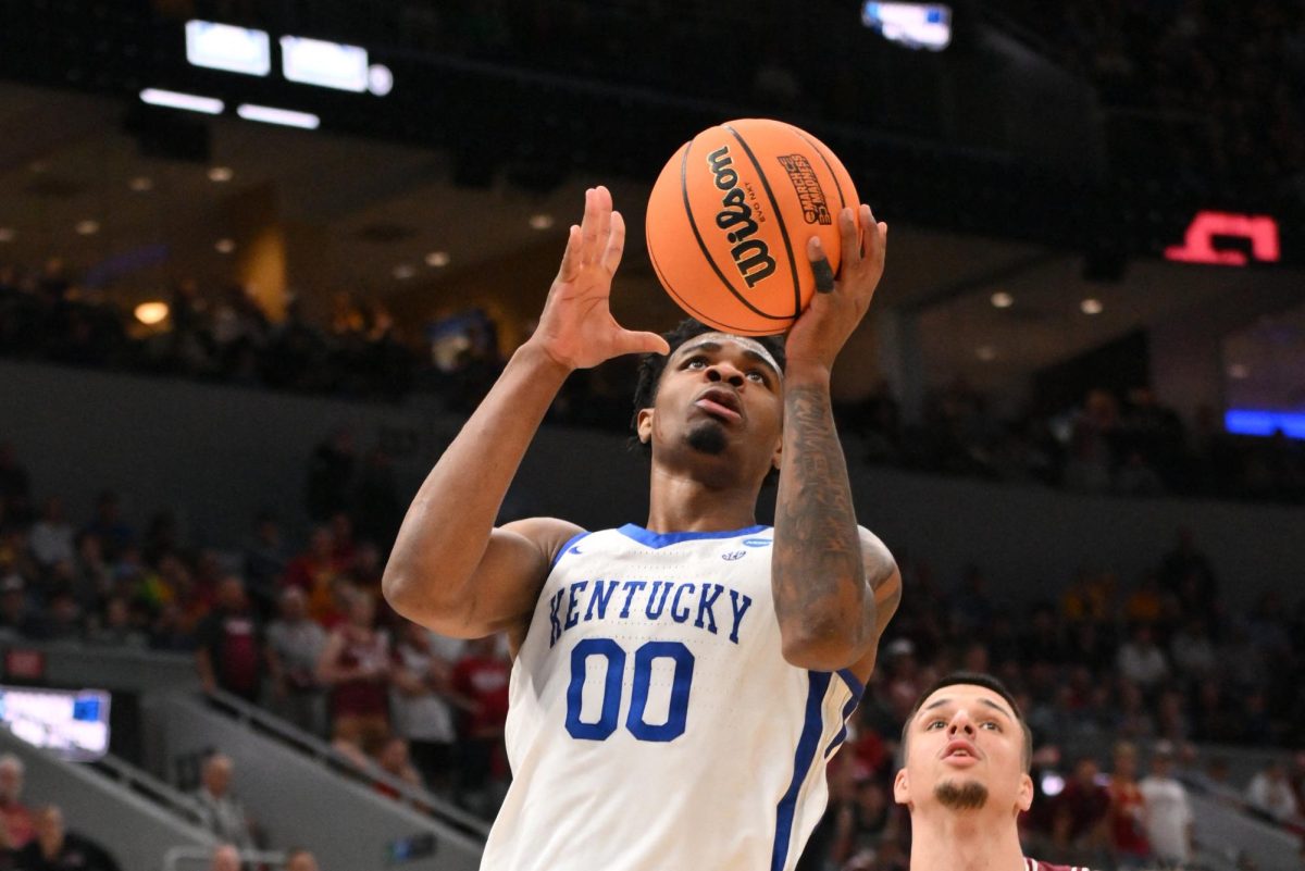 Mar 20, 2026; St. Louis, MO, USA; Kentucky Wildcats guard Otega Oweh (00) shoots the ball against Santa Clara Broncos guard Sash Gavalyugov (2) during the second half of a first round game of the men's 2026 NCAA Tournament at Enterprise Center. Mandatory Credit: Jeff Curry-Imagn Images